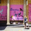 "Birdwatching Is Not A Crime": Boarded Up Storefronts Become Canvas For Street Artists